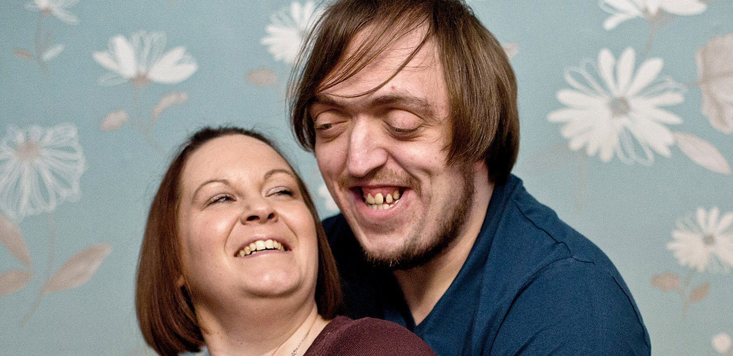 photo of smiling couple from charity Changing Faces