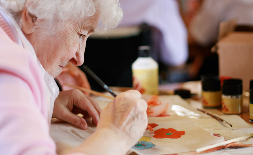 a woman painting at St Davids Hospice Care